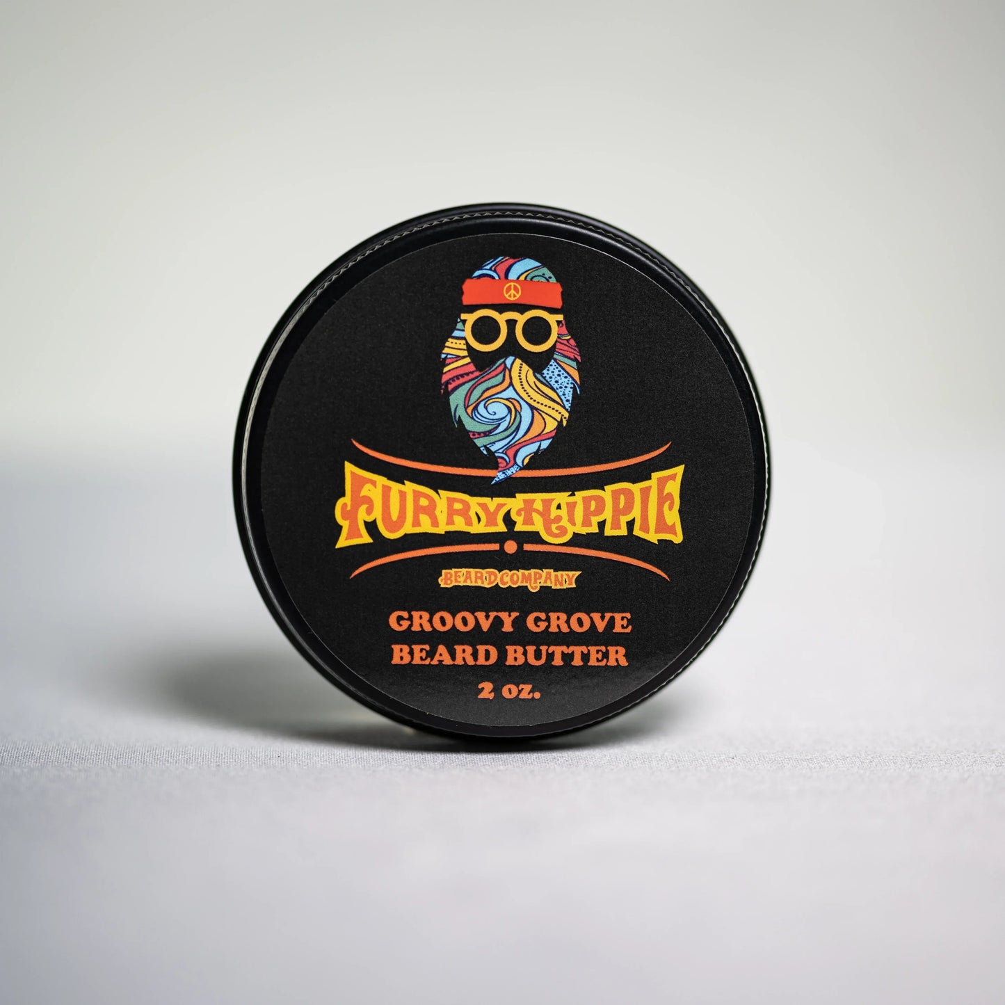 2oz jar of Groovy Grove orange vanilla beard butter by Furry Hippie Beard Company