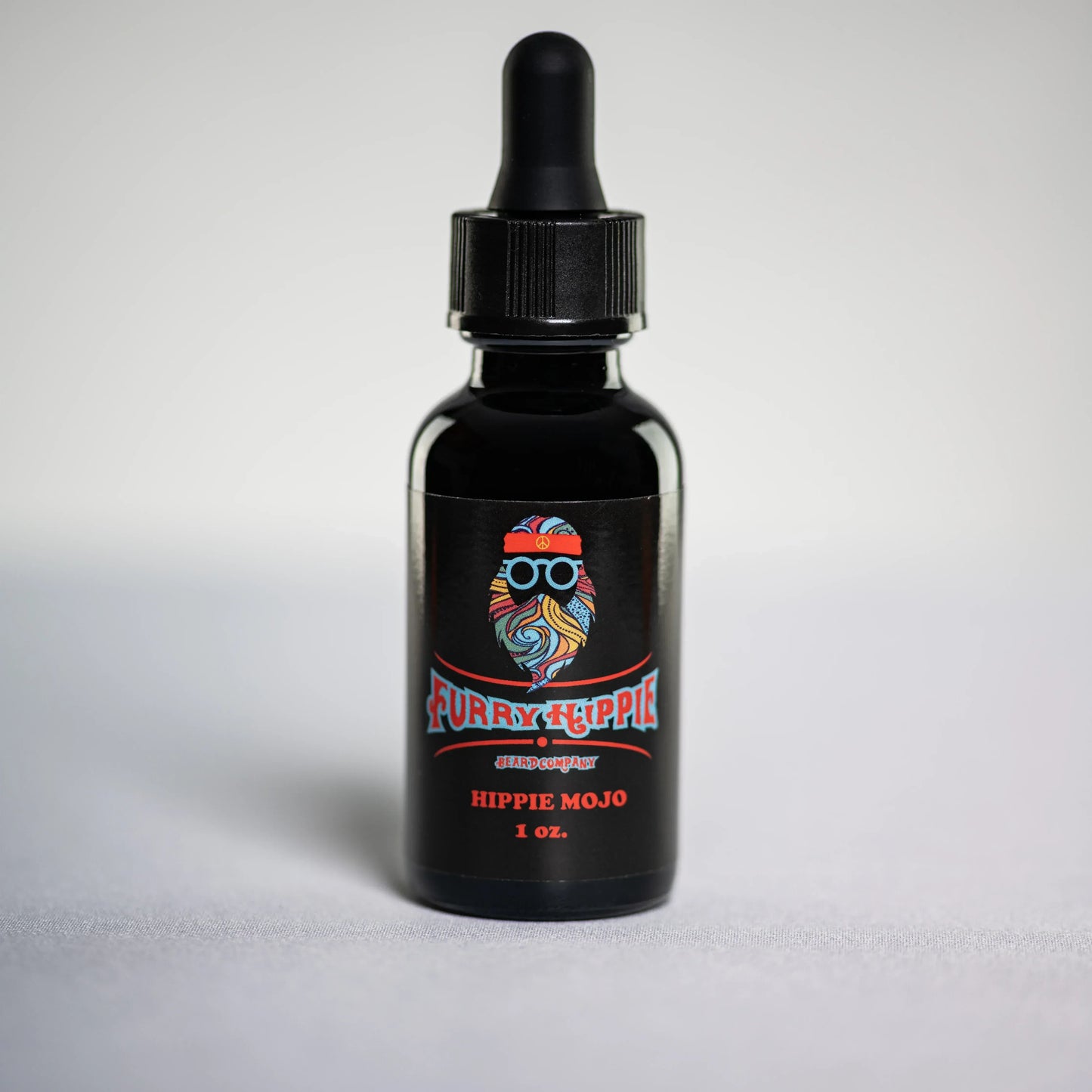 1oz bottle of Hippie Mojo patchouli incense beard oil by Furry Hippie Beard Company
